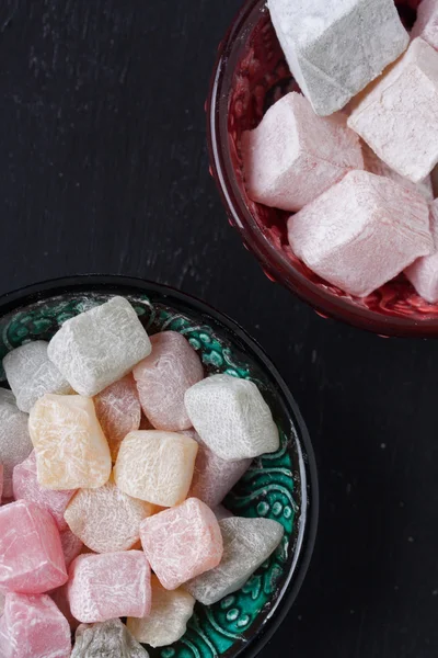 Turkish delight on a black background — Stock Photo, Image