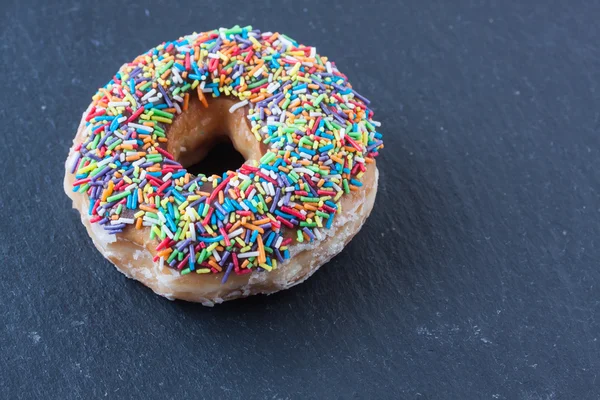 Donut with sugar sprinkles — Stock Photo, Image