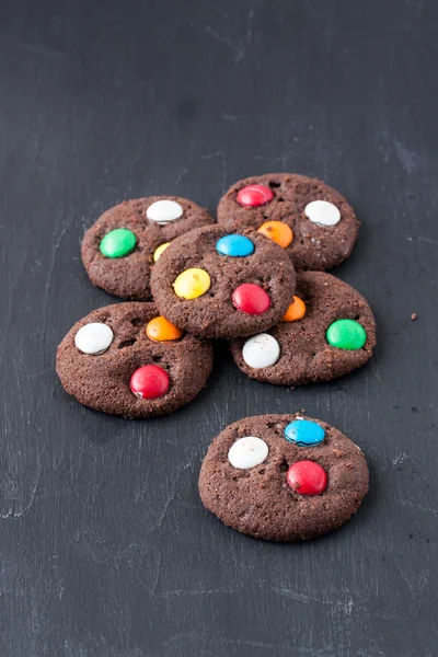 Chocolate cookie with sugar coated candy — Stock Photo, Image