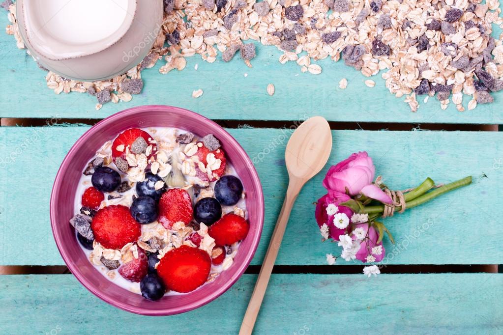 Muesli in bowl on table Stock Photo by ©Bernashafo 66645531