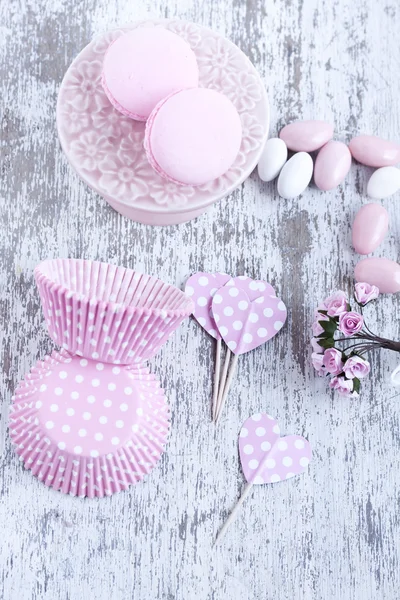 Sugar coated candies, cupcake baking cups, macaroons — Stock Photo, Image