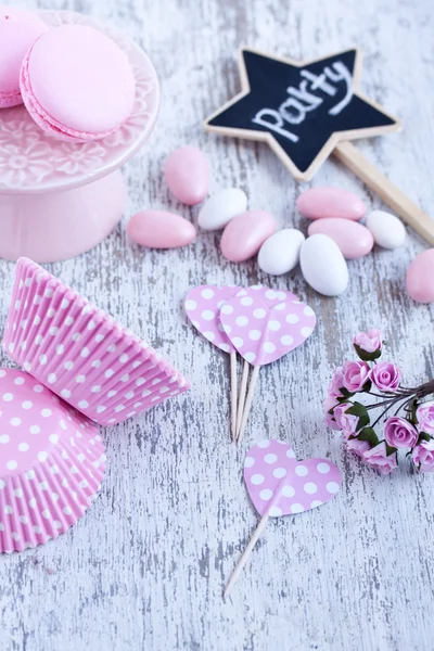 Sugar coated candies, cupcake baking cups, macaroons — Stock Photo, Image