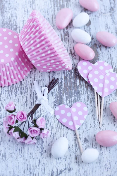 Sugar coated candies, cupcake baking cups — Stock Photo, Image