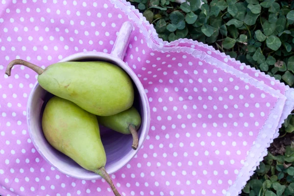 Pears in a cup close up — Stock Photo, Image