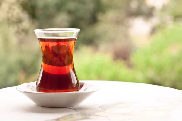 Tea in a traditional turkish glass — Stock Photo, Image
