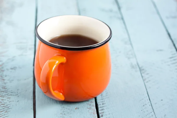 Orange mug of coffee — Stock Photo, Image