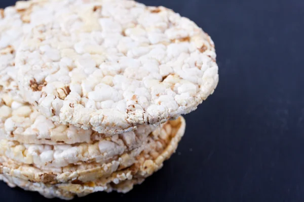 Rice cracker on a black background — Stock Photo, Image