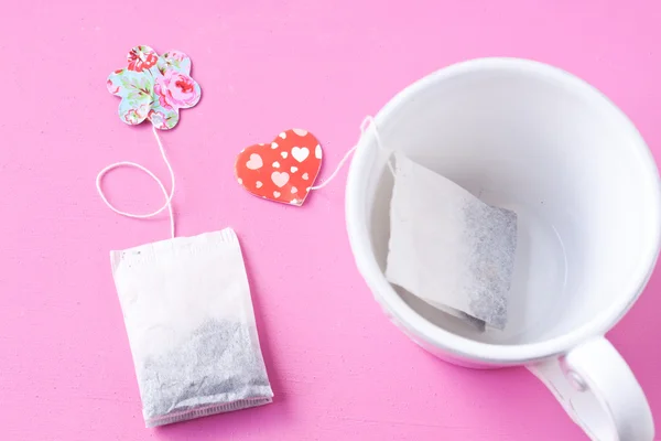 Cup with tea bags — Stock Photo, Image