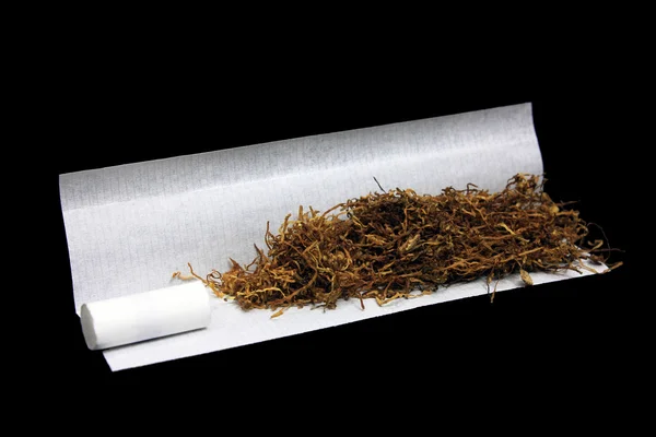 Tobacco with filter tip and paper — Stock Photo, Image