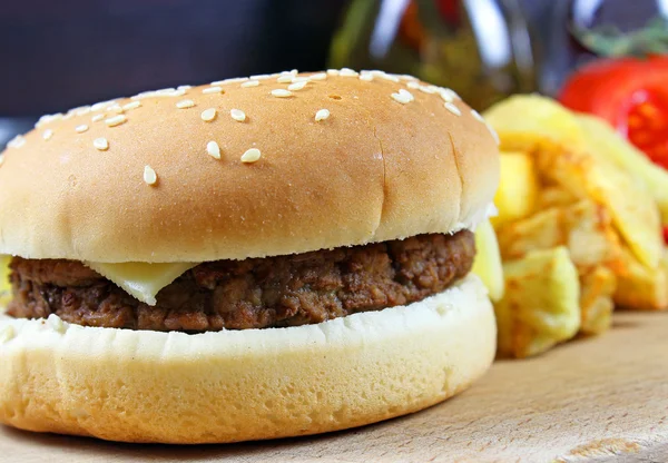 Hamburger fast food with plenty of raw materials — Stock Photo, Image