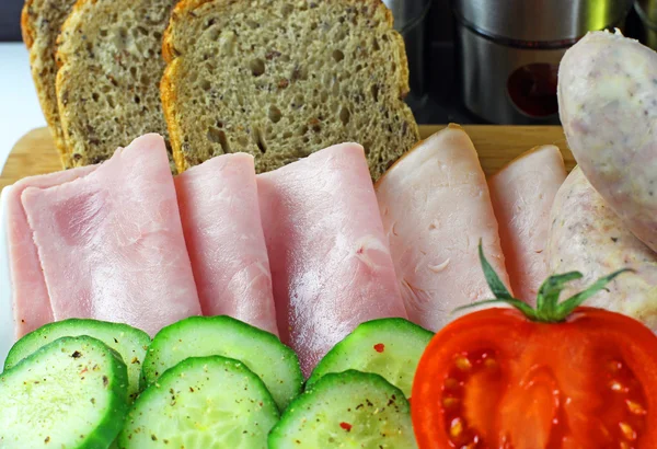 Tomatoes, cucumber, ham and white sausage — Stock Photo, Image