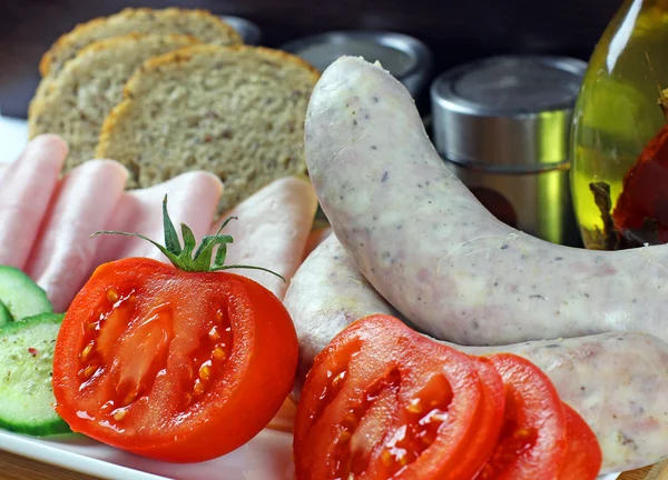 Tomatoes, cucumber, ham and white sausage — Stock Photo, Image