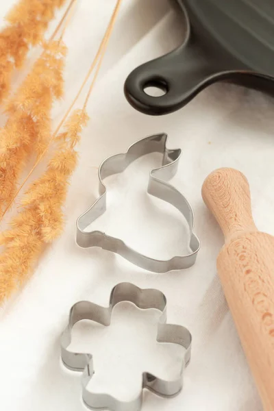 Easter cake molds, bunny cookie cutter. Home baked cookies for the holidays. Roll out the dough