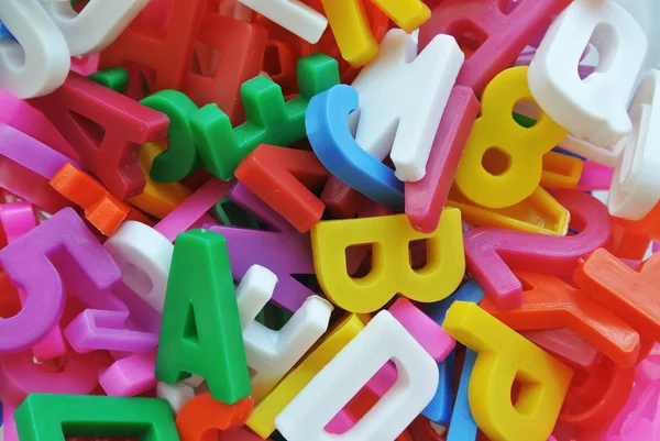 Textura de fundo de diferentes letras aleatórias juntas — Fotografia de Stock