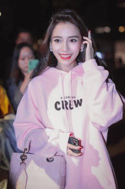Chinese model, actress, and singer Angela Yeung Wing, better known by her stage name Angelababy, arrives in an airport in Shanghai, China, 24 October 2020. clipart