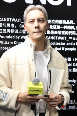 Hong Kong singer, dancer and actor William Chan attends a commercial event in Shanghai, China, 5 October 2020. clipart