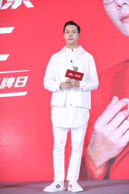 Hong Kong singer, dancer and actor William Chan attends a commercial activity in Shanghai, China, 14 October 2020. clipart