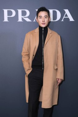 Chinese actor and singer Luo Jin stands for Prada promotional event in Beijing, China, 9 December 2020. clipart