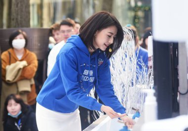 Chinese actress Gao Yuanyuan attends a charity campaign by the West Lake, she cleans her hands by using cold water during the cold winter, calling the public's attention to poor children's hygiene issues in Hangzhou City, east China's Zhejiang Provin clipart