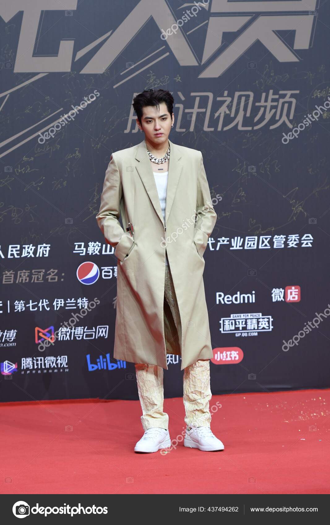 Chinese actor Kris Wu poses at a promotional conference for his