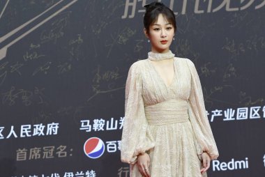 Chinese actress Yang Zi, dressing in a Luisa Beccaria lacy dress in Nanjing City, east China's Jiangsu Province, 20 December 2020.  clipart