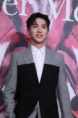 Chinese actor and singer-songwriter Xu Weizhou, known internationally as Timmy Xu, attends an activity of McQueen in Shanghai, China, 16 December 2020.  clipart