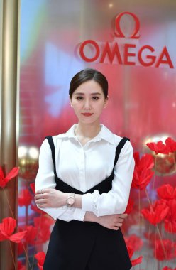 Chinese actress Liu Shishi, also known as Cecilia Liu attends a promotional campaign for Swiss luxury watchmaker Omega SA in Shanghai, China, 6 July 2021. clipart