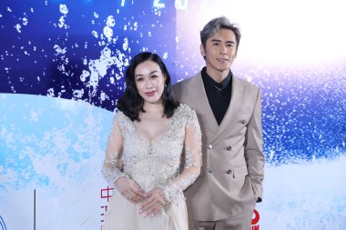 Canadian actress and restauranteur Christy Chung and her husband, Chinese actor Shawn Zhang Lunshuo attend an event in Shanghai, China, 16 March 2021. clipart