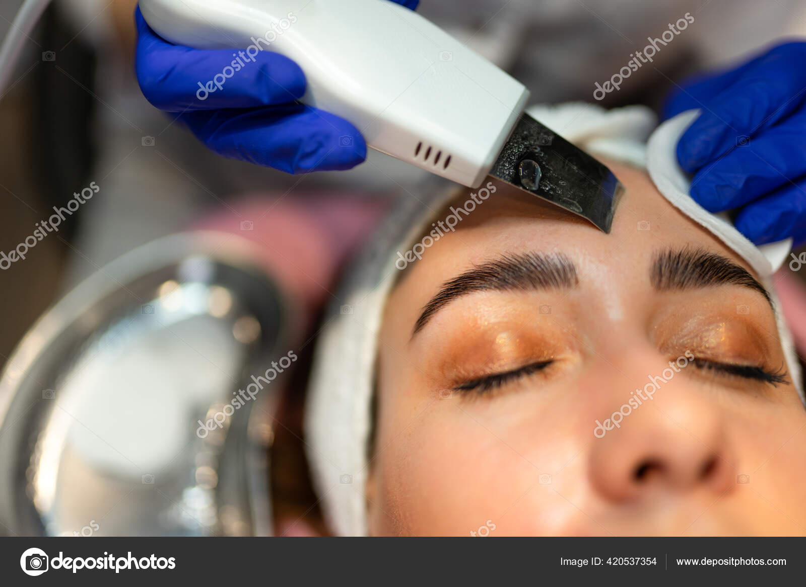 Facial Cleansing Procedure Ultrasonic Scrubber Stock Photo by ©borodai