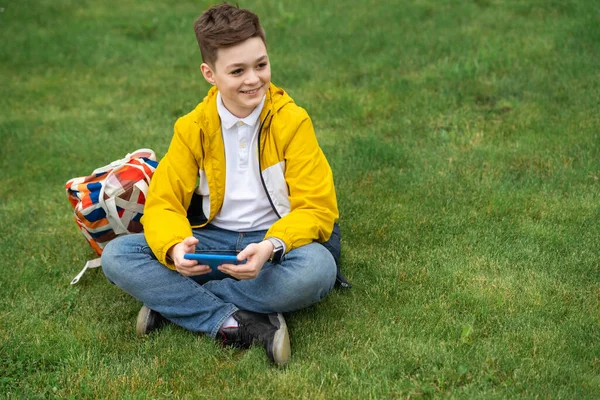 Schoolboy Sits Lawn Smart Phone His Hands Modern Teenager Yellow — Stock Photo, Image