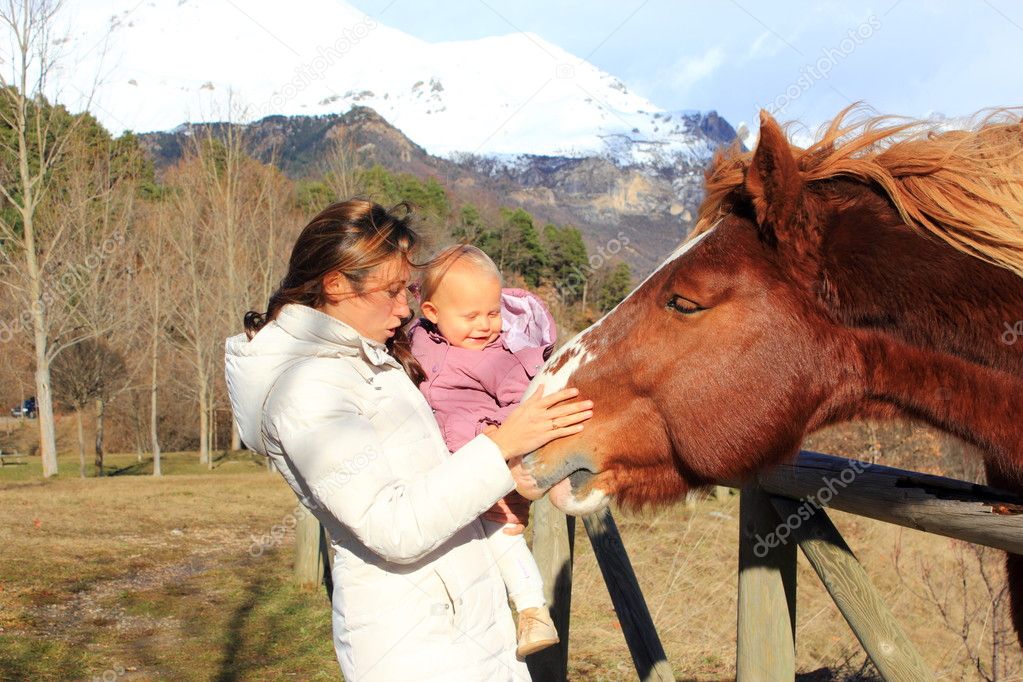 Mother and Baby with  horse  in Pyrenees mountains