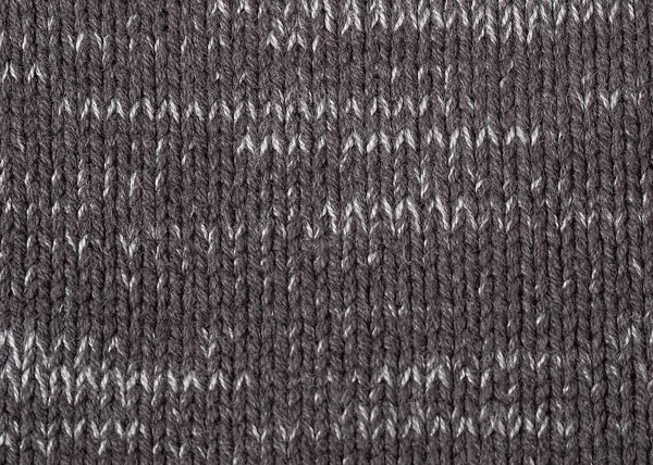 melange background. Knitted textured background of woolen threads of different colors and patterns