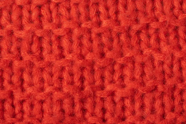 Soyut örülmüş kırmızı mercan örülmüş arka plan, yakın plan. Hobi konsepti