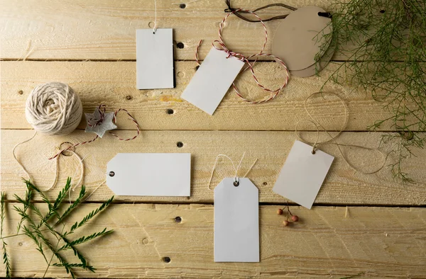 Set of empty paper price tags, wooden background — Stock Photo, Image