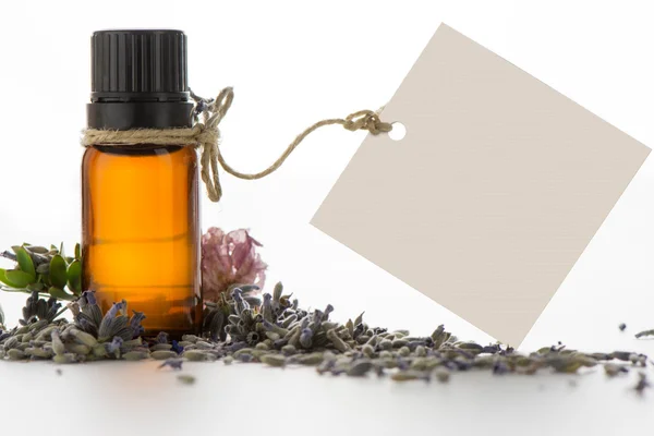 Essential oil, empty tags and lavender flowers — Stock Photo, Image