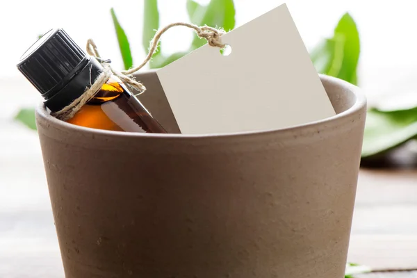 Essential oil, empty tags, in a clay jar — Stock Photo, Image
