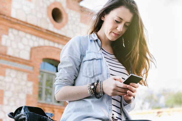 beautiful brunette woman talking on the phone