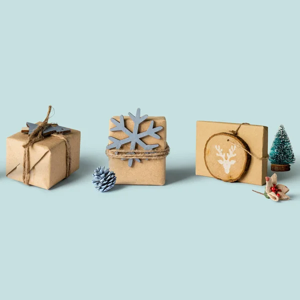 stock image Christmas composition. Funny Christmas gifts box with homemade wrapping, and decoration on blue  background, Christmas, winter, new year or shopping concept.