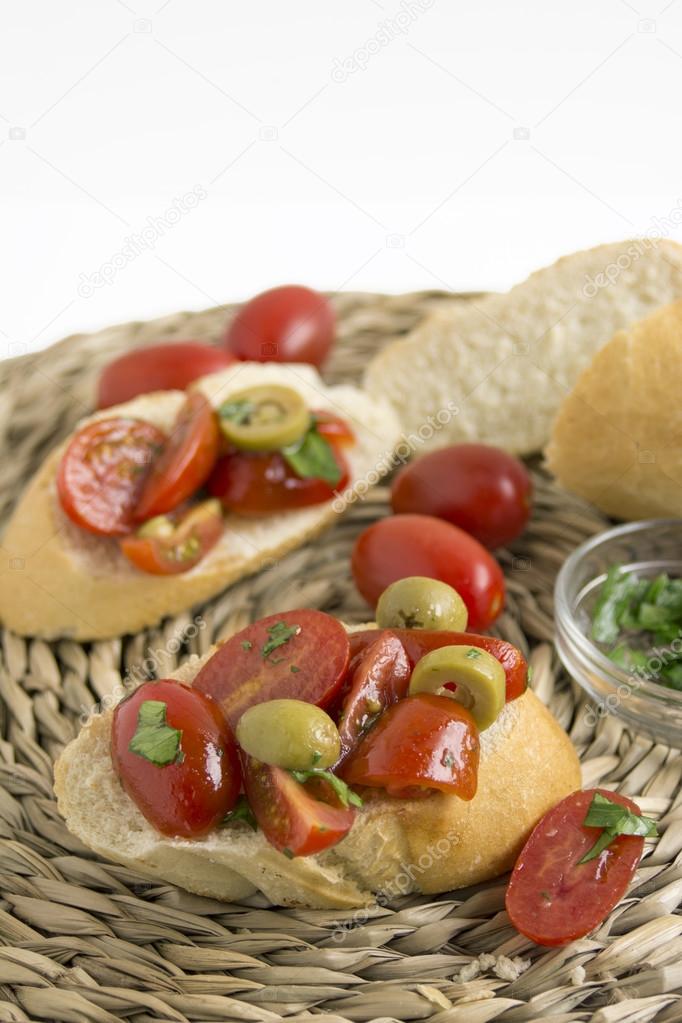 Spanish food tapas. Toast with fresh tomato and basil 