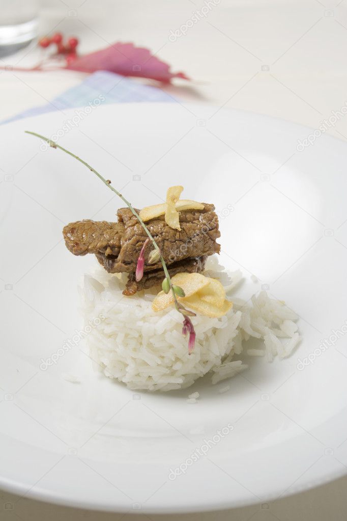 white rice with beef on wooden background