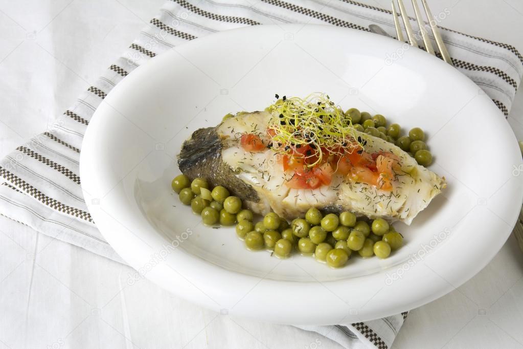 Hake fillet with tomato and sprouts,