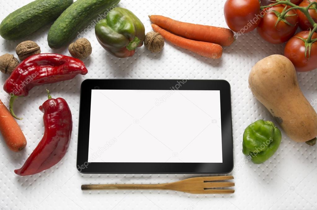 Digital tablet with fresh vegetables