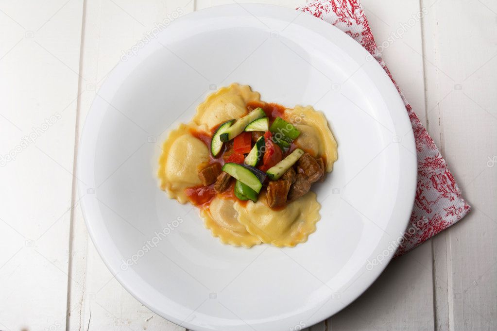 fresh meat tortellini with tomato and sauteed vegetables
