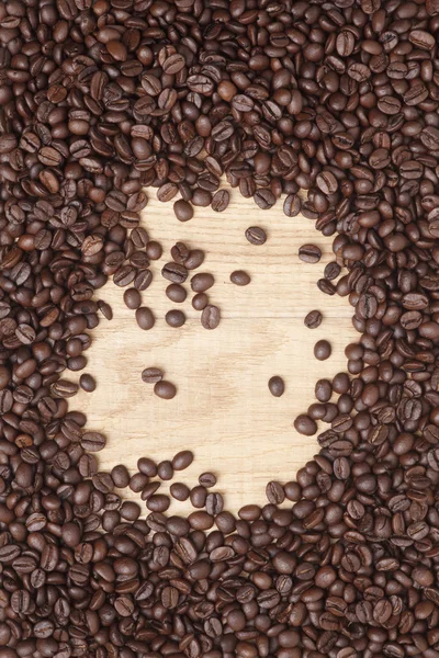 Caffe edition, kaffebönor på trä bakgrund — Stockfoto