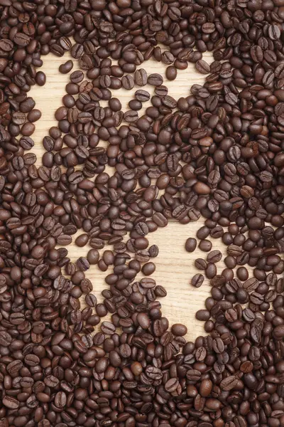 Caffe edition, Kaffeebohnen auf Holzgrund — Stockfoto