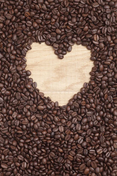 Caffe edition, ahşap arka plan üzerinde kahve çekirdekleri