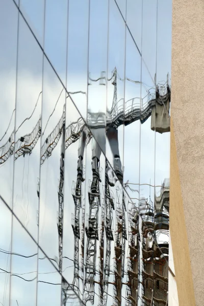 Reflection in windows of modern office building — Stock Photo, Image