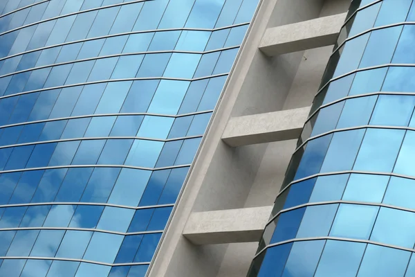 Reflection in windows of modern office building — Stock Photo, Image