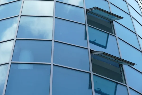 Reflection in windows of modern office building — Stock Photo, Image