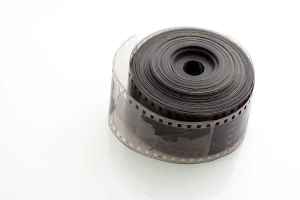 Velho negativo 35 milímetros tira de filme no fundo branco — Fotografia de Stock